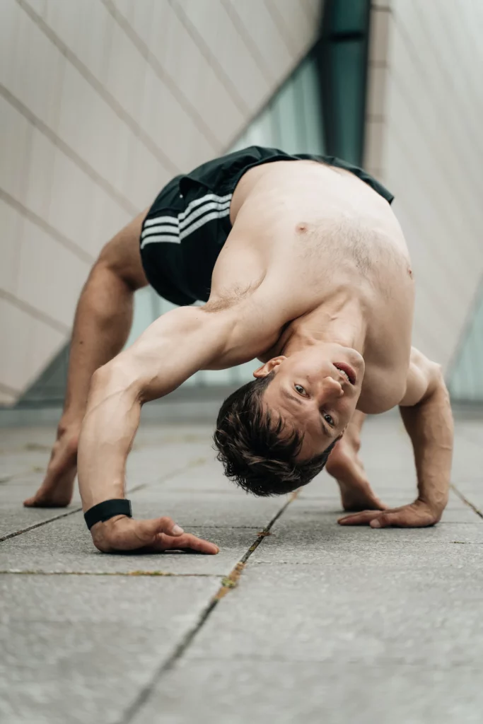 Man doing gymnastics in Southampton - performing a back bend