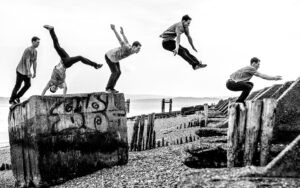 Man doing parkour, jumping between concrete blocks in Hampshire